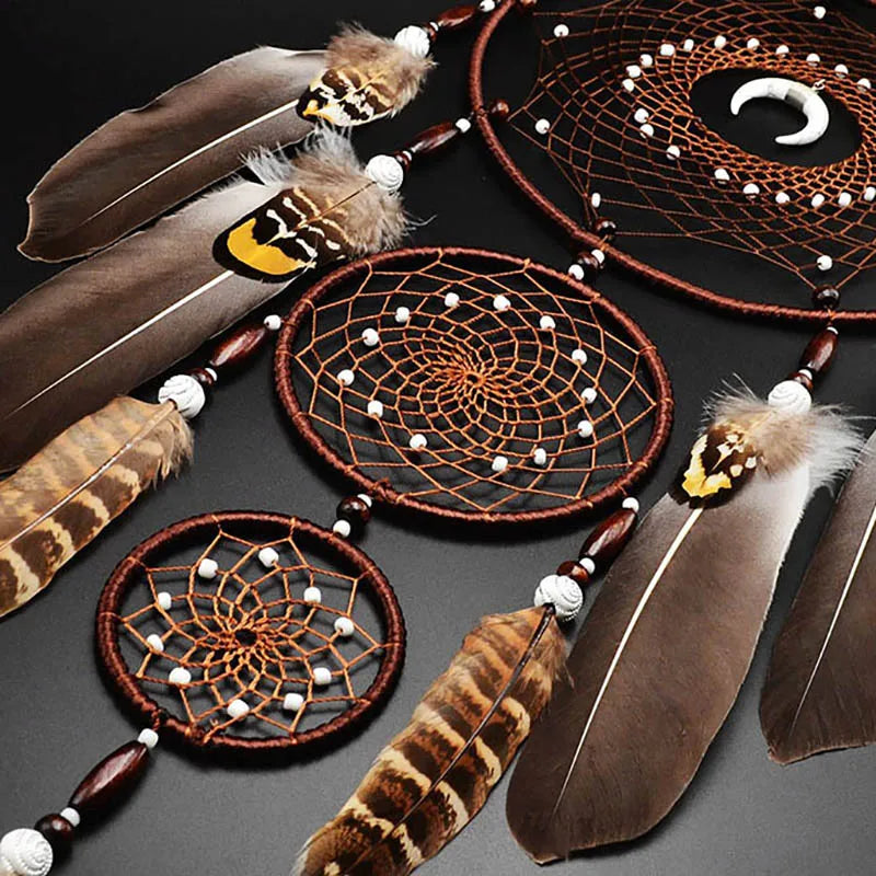 Feather dream catcher hanging on wall