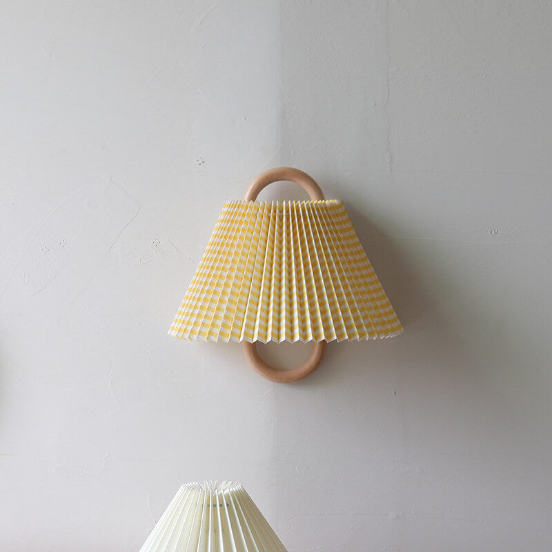 Yellow pleated half-moon wall light