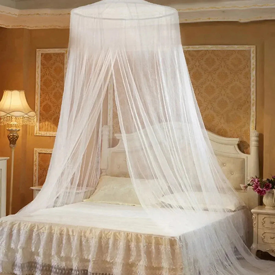 Hanging dome mosquito net over a bed