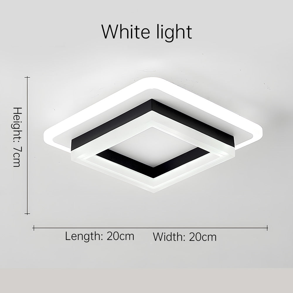 Square LED ceiling light lit in a bedroom
