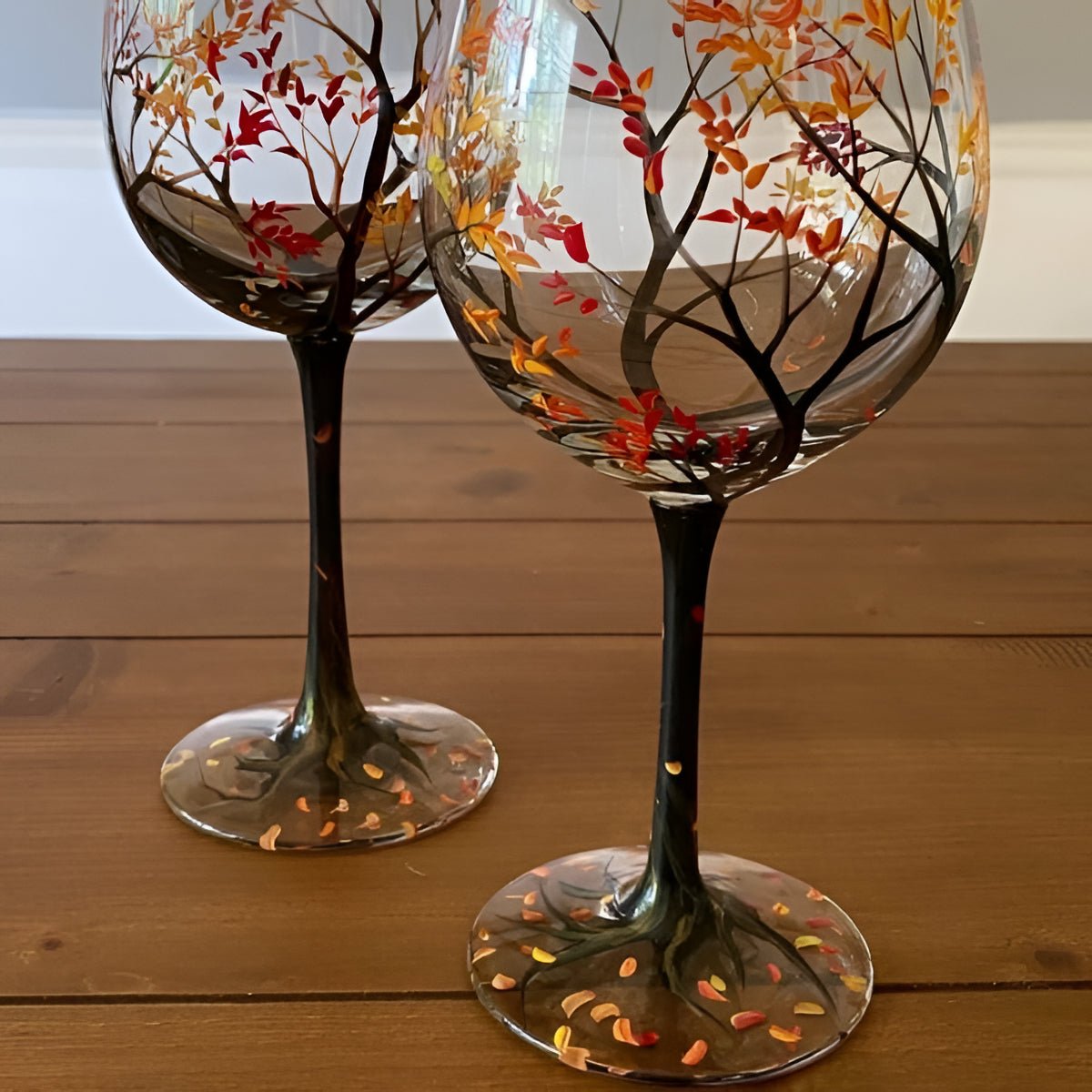 Stemmed wine glass with autumn tree