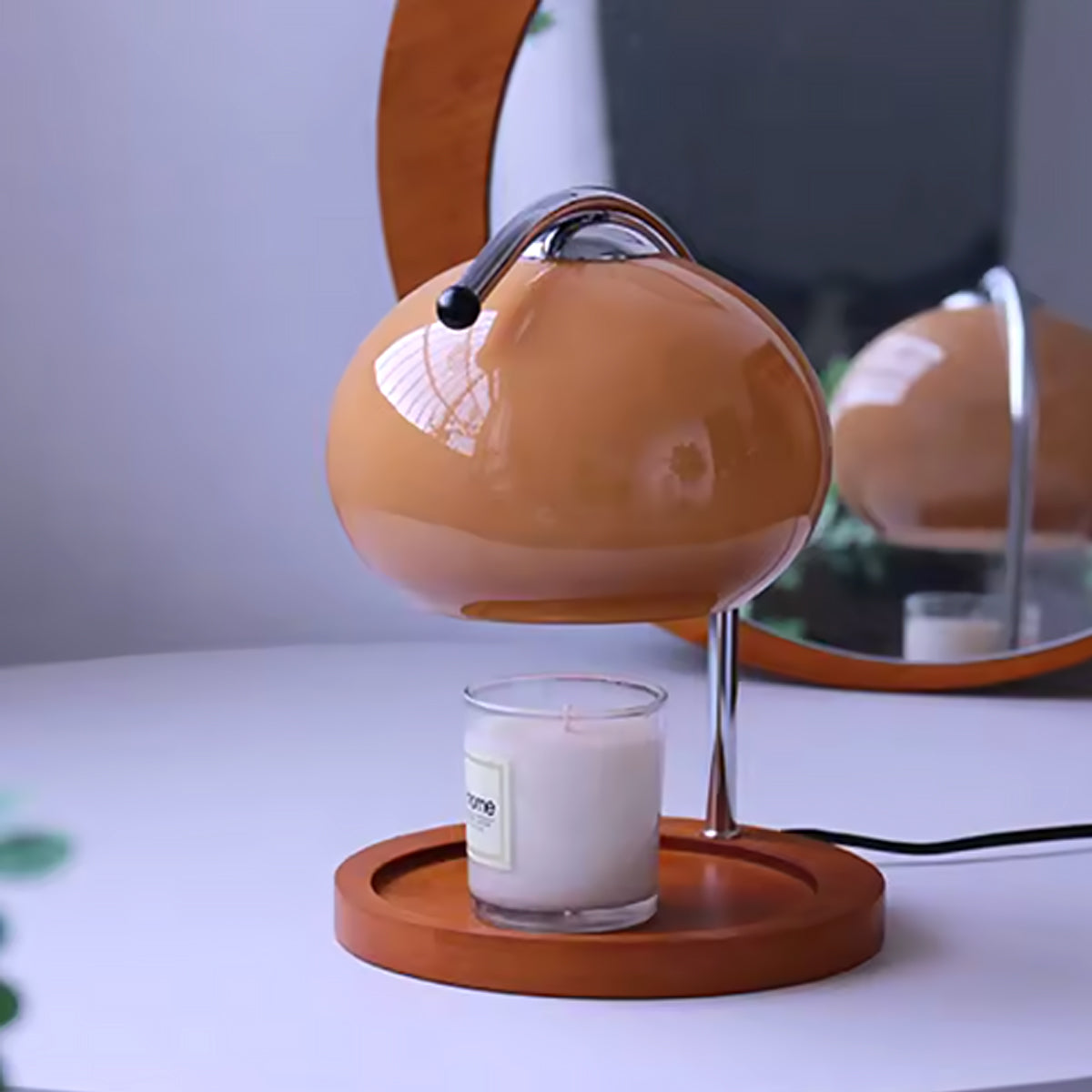 Retro candle warmer lamp on a side table