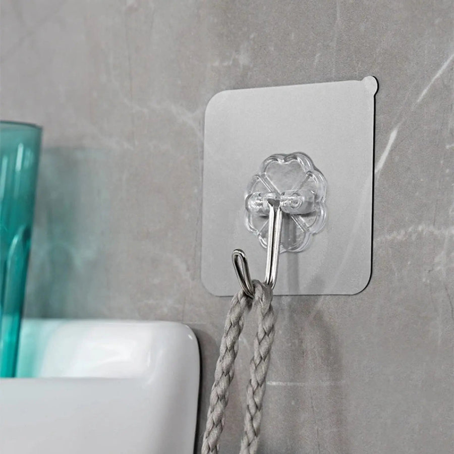 Clear self-adhesive wall hooks on tiles