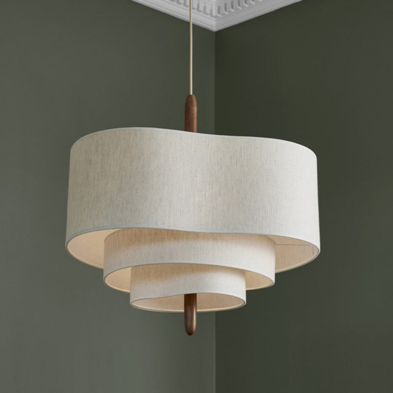 Fabric drum chandelier over a dining table