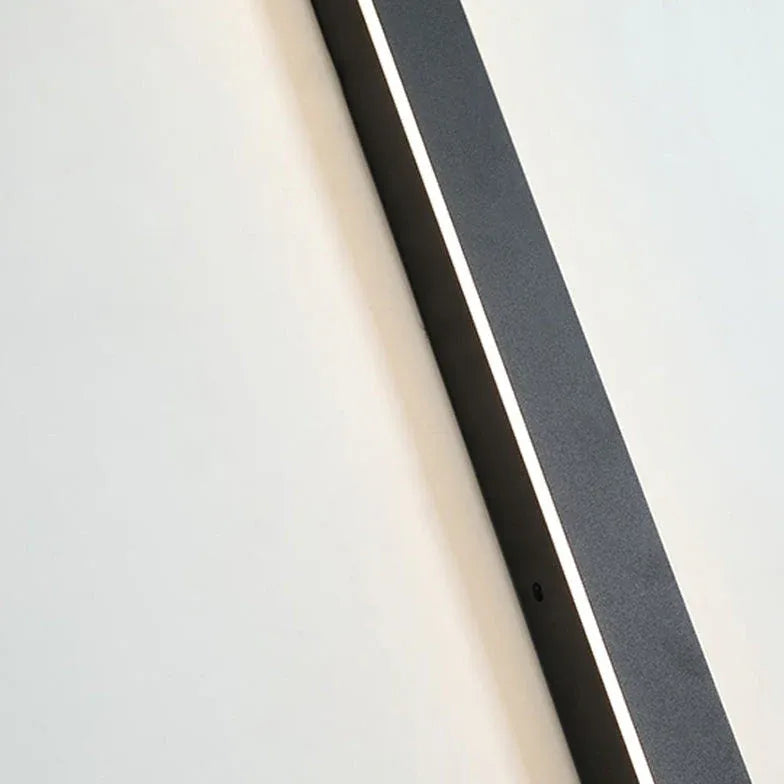 Minimalist linear metal outdoor wall lamp on a balcony