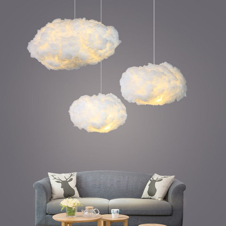 Cloud ceiling light hanging over a bed