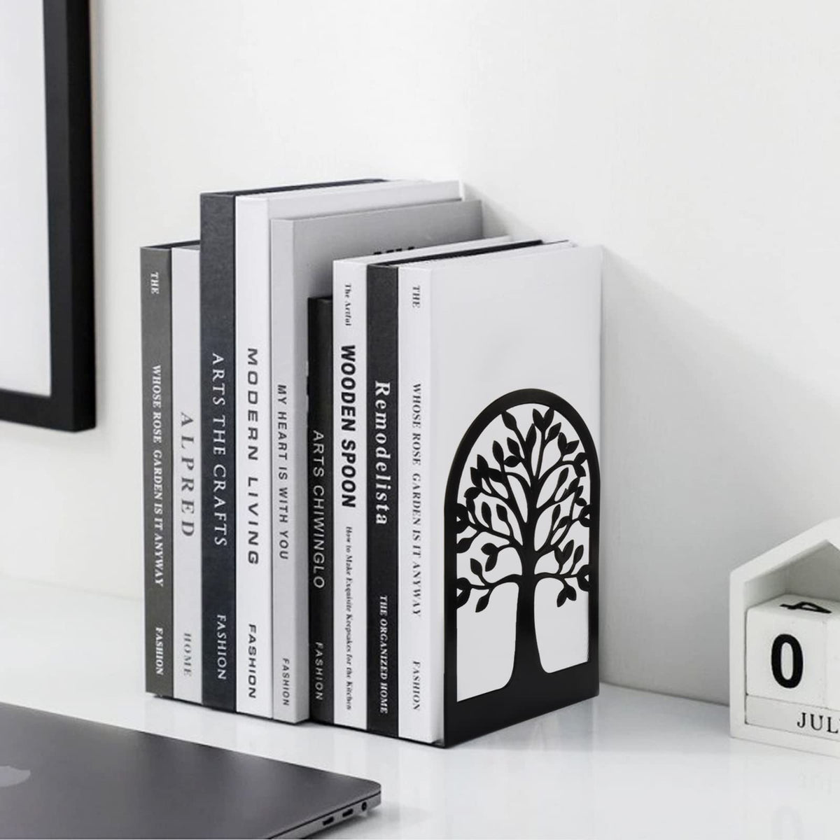 Tree of Life metal bookends holding books