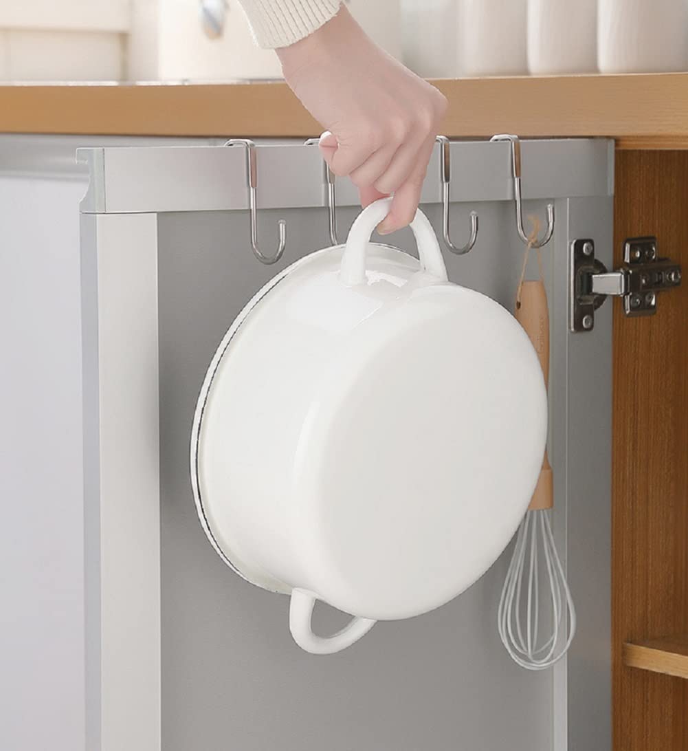 S hook holding a towel on cabinet