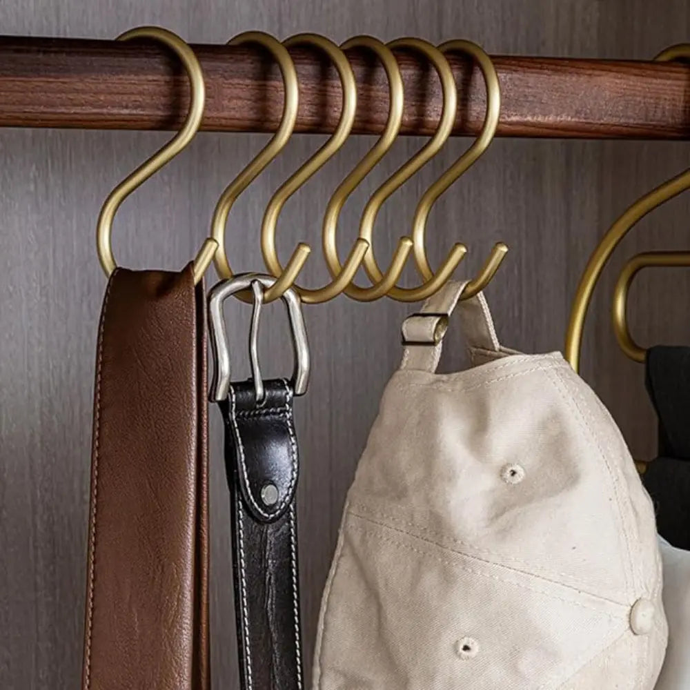 S-hooks hanging from a wardrobe rail