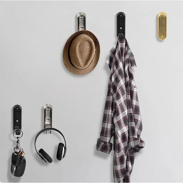 Folding wall hook holding a towel