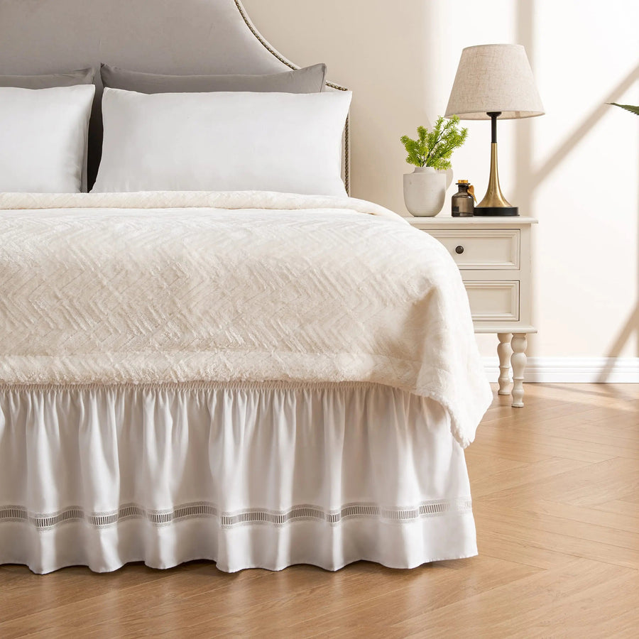 White crochet lace bed skirt on a bed