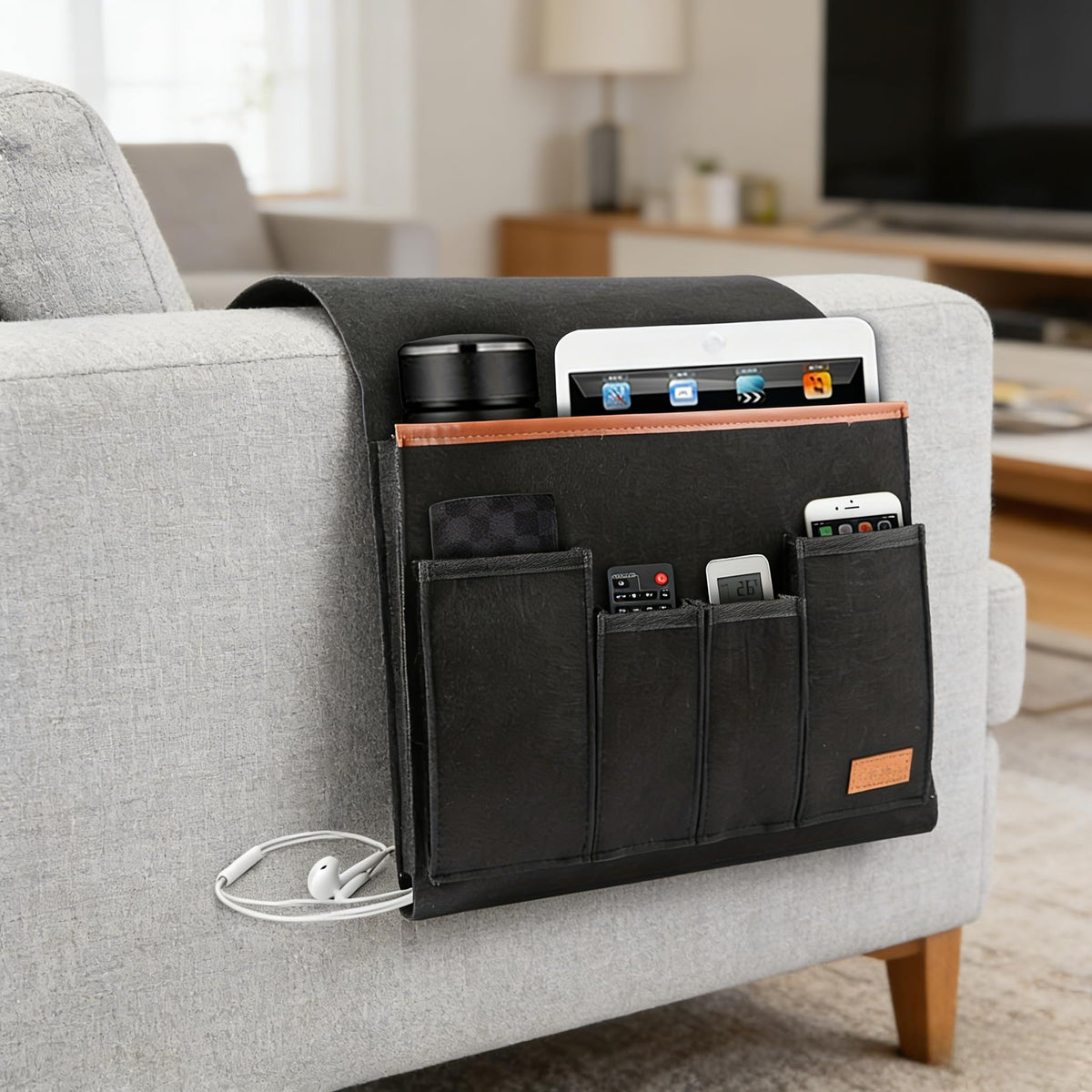 Felt armrest caddy hanging on a sofa