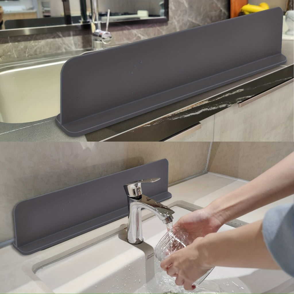 Splash guard blocking water spray at the tap