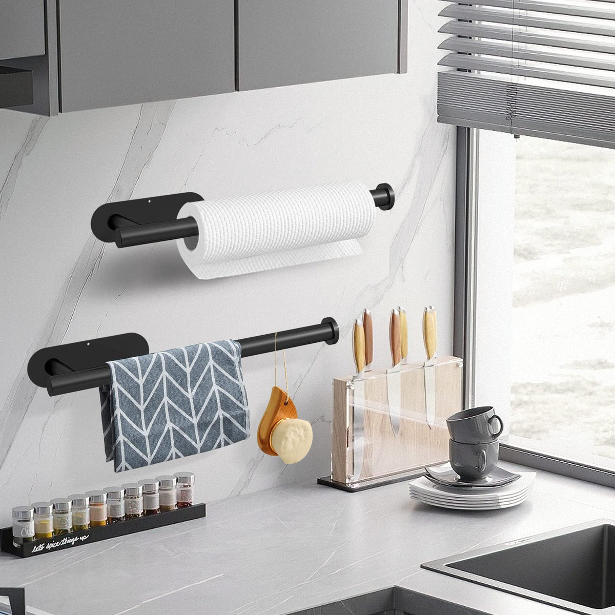 Stainless steel adhesive paper towel holder mounted under a kitchen cabinet