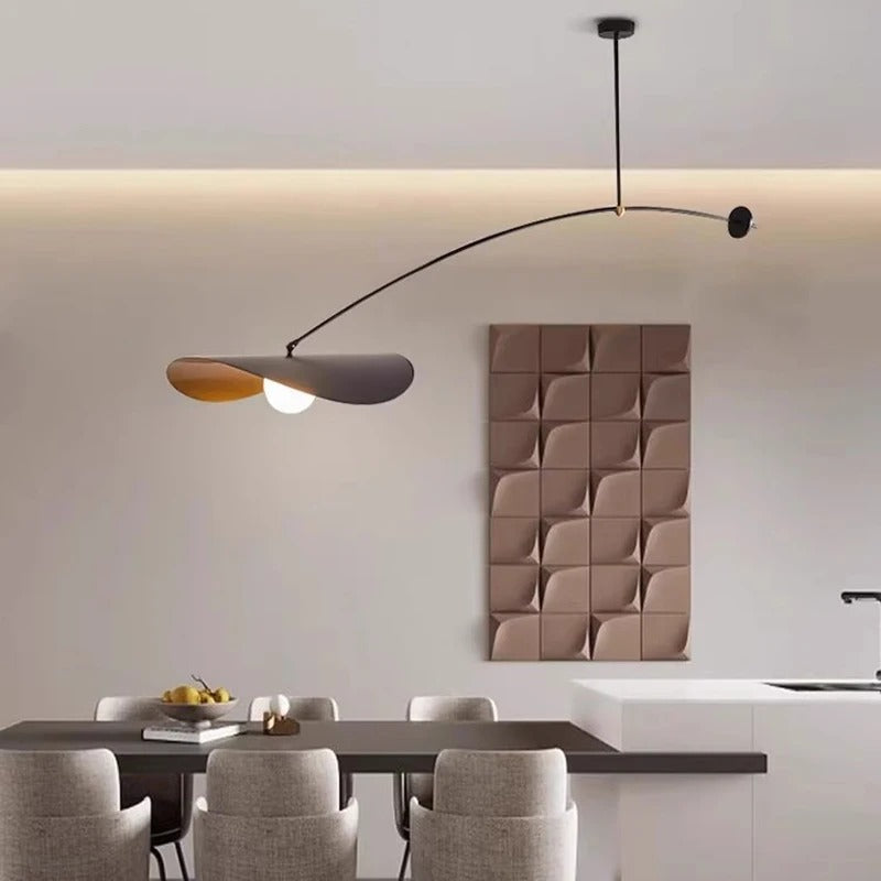 Matte black long arm pendant lighting a table