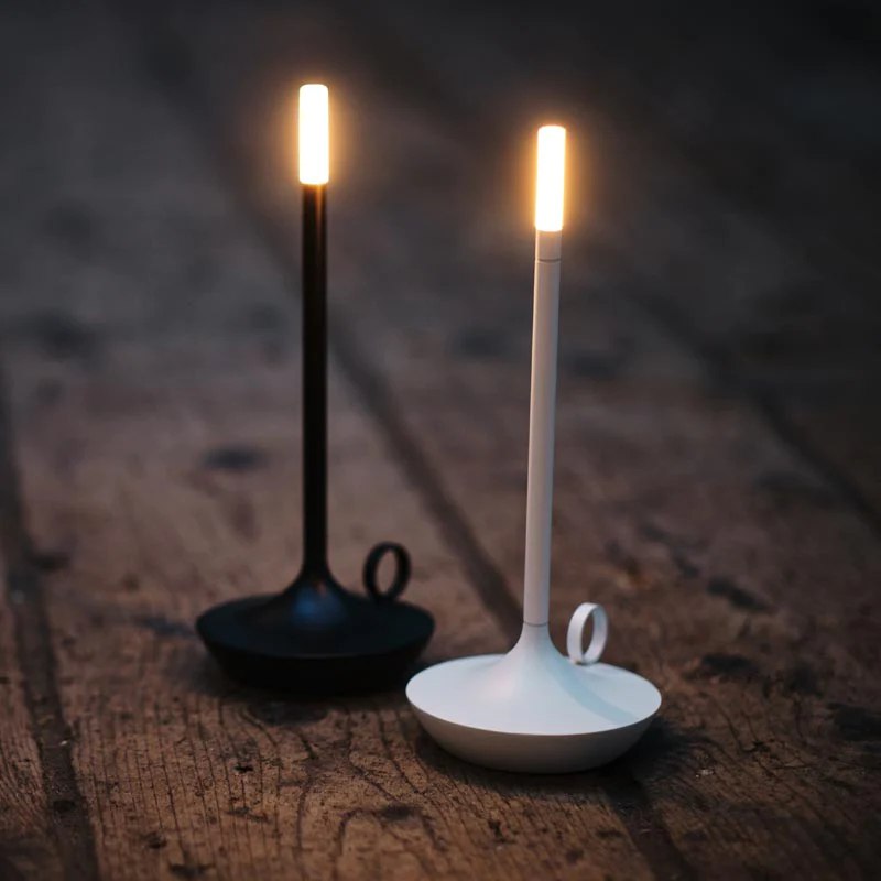 Candlestick lamp on a bedside table