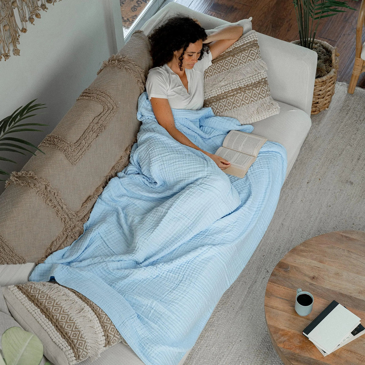 Cotton muslin throw blanket draped on a bed