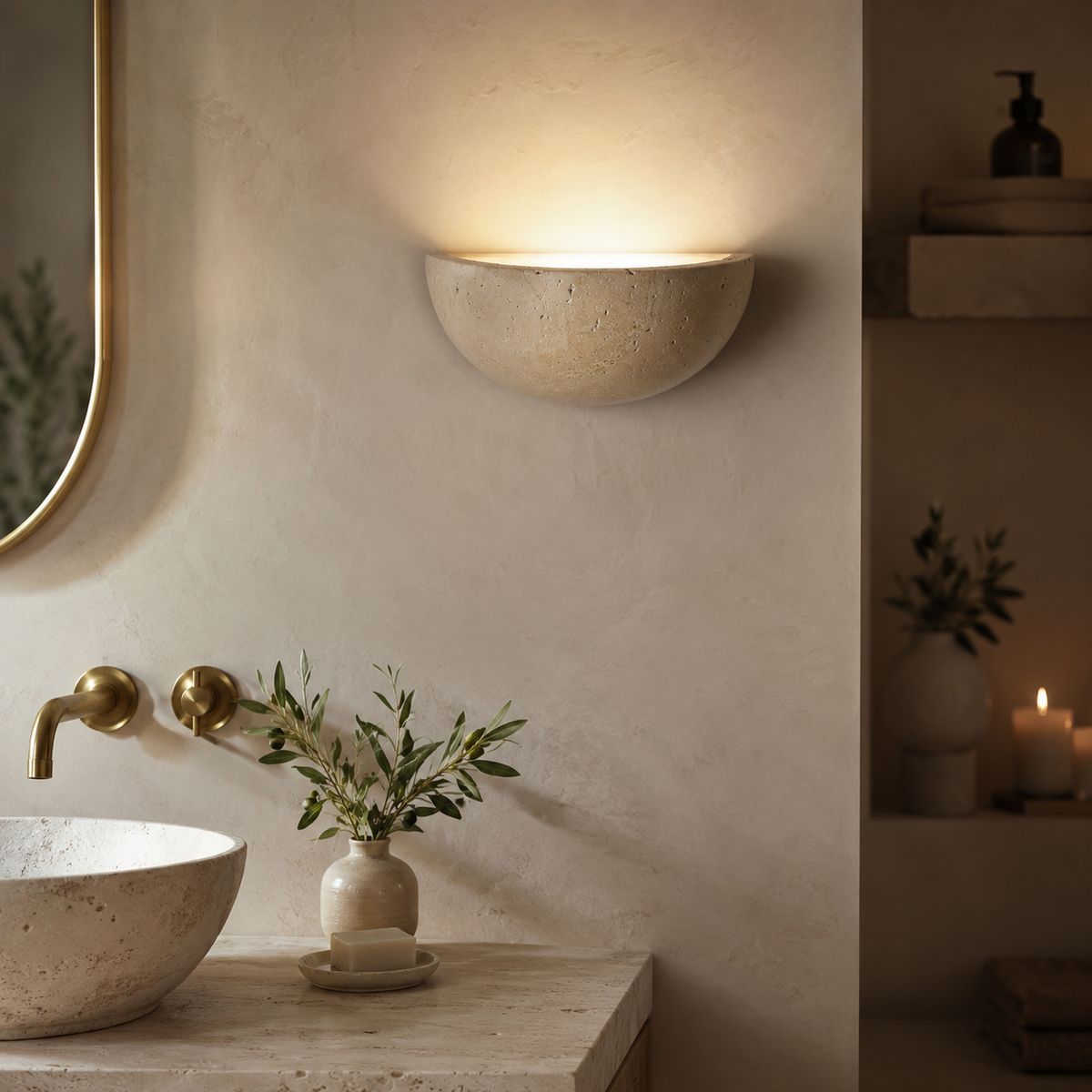 Travertine wall light beside a bed